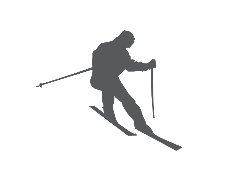 a silhouette of a person skiing down a hill