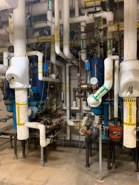 A room filled with lots of pipes and valves