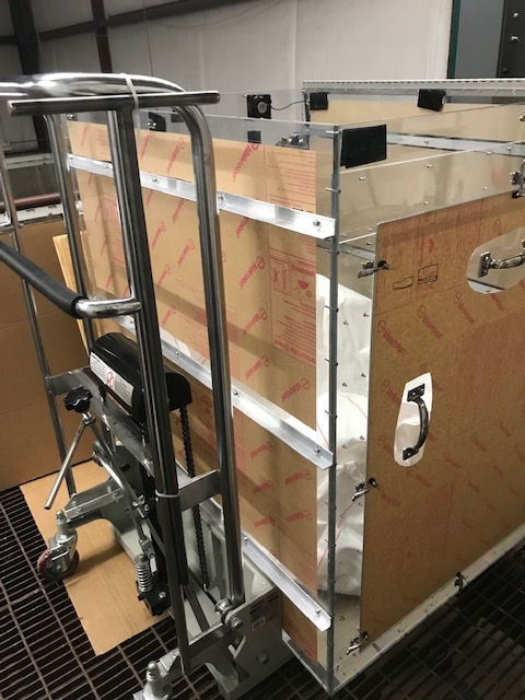 A cart with a handle on the side of it