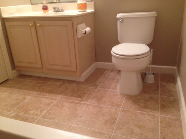 A bathroom with a toilet and a sink