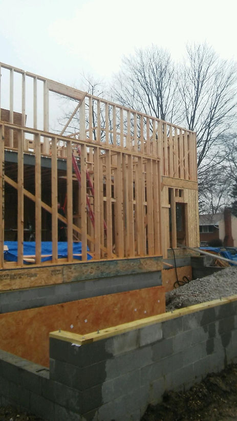 A house is being built with wooden frames.