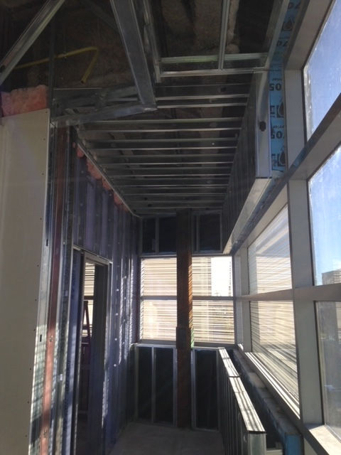 A building under construction with a lot of windows