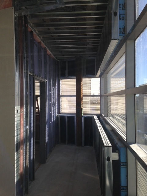 A long hallway with a sign that says ' a ' on it