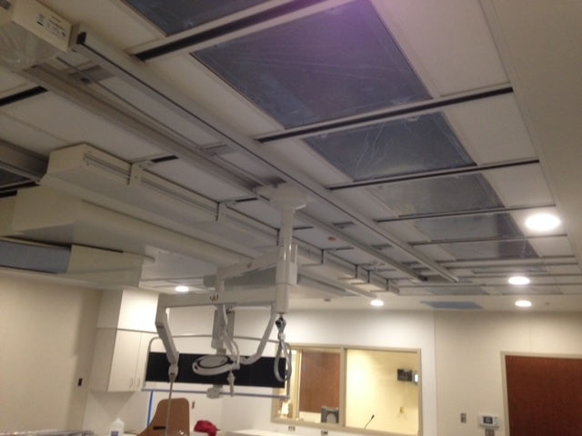 A hospital room with a ceiling that has a lot of lights on it