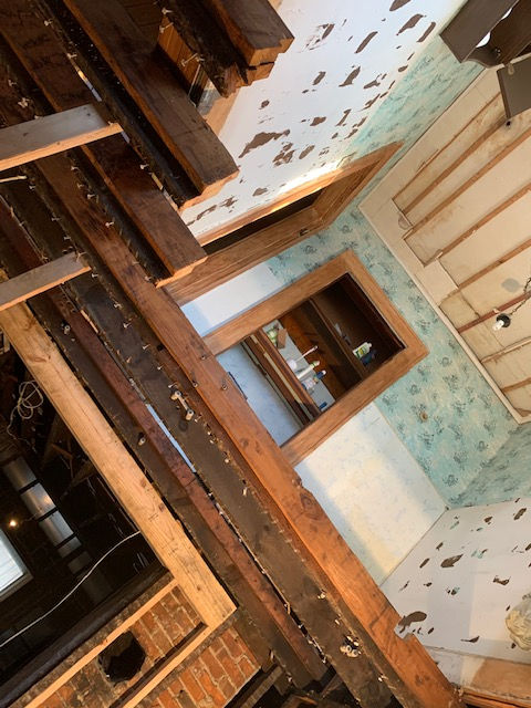 A room with wooden beams and a window