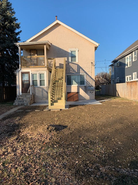 A house with stairs leading up to the second floor