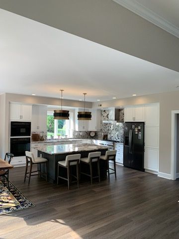 A large kitchen with a large island and stools