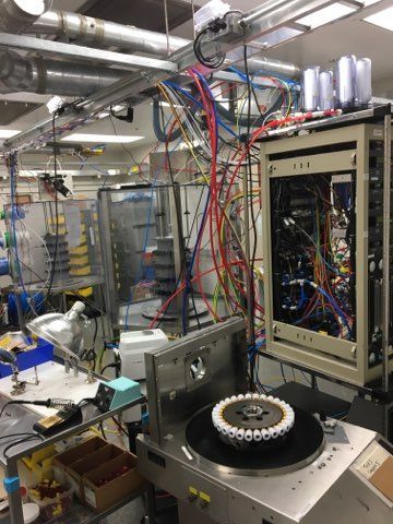 A room filled with lots of wires and a machine.