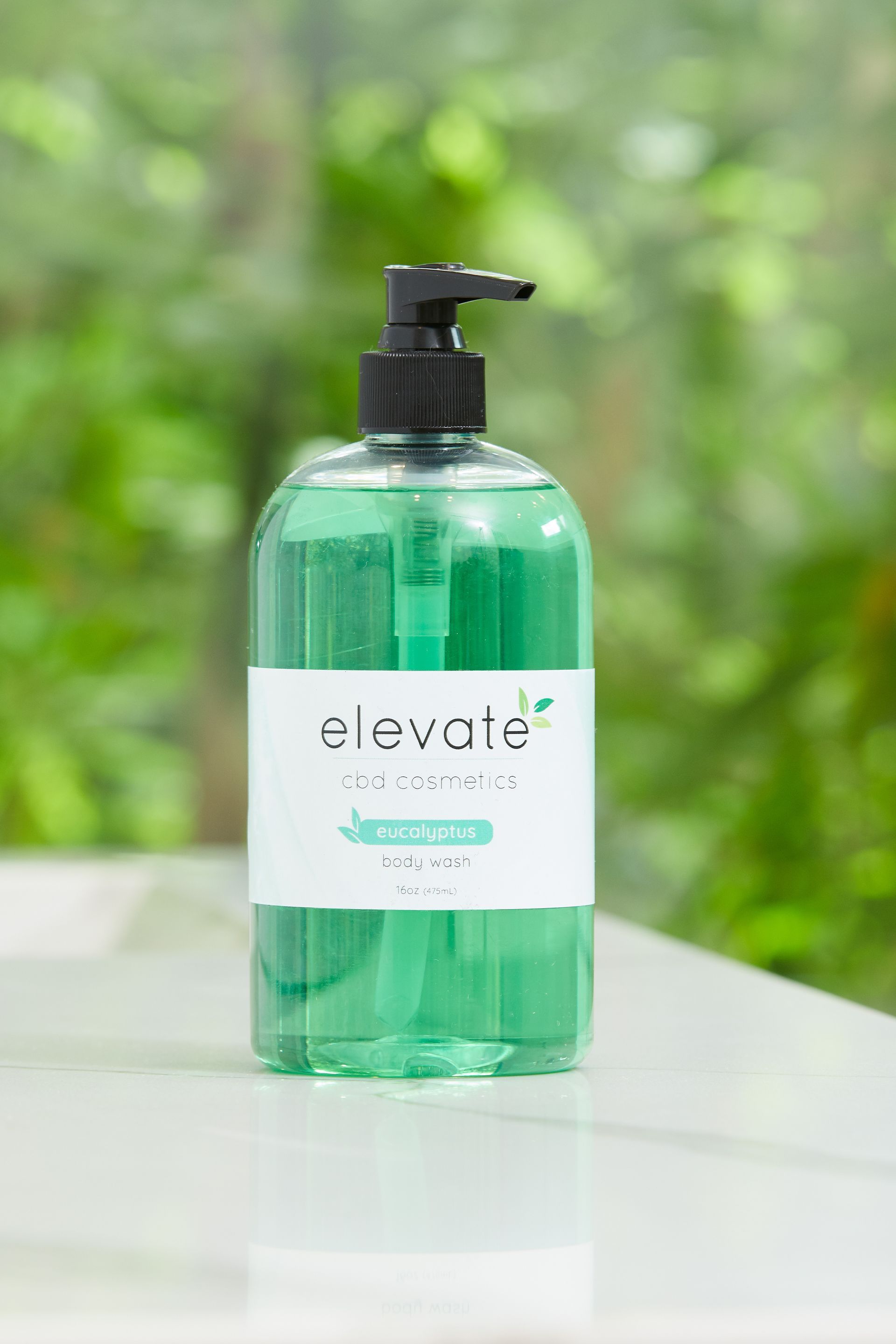 A bottle of elevate hand soap is sitting on a table.