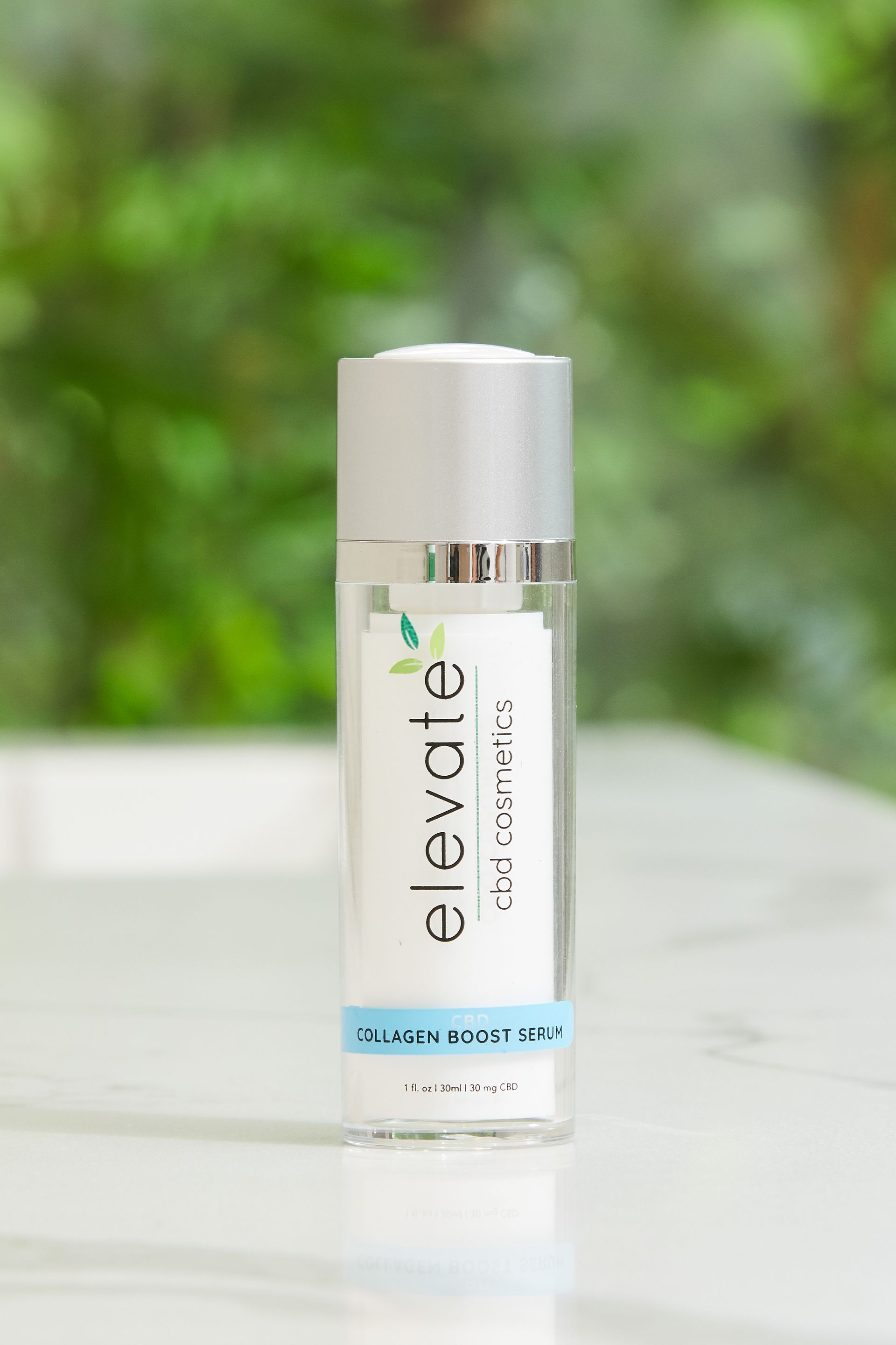 A bottle of elevate lotion is sitting on a table.