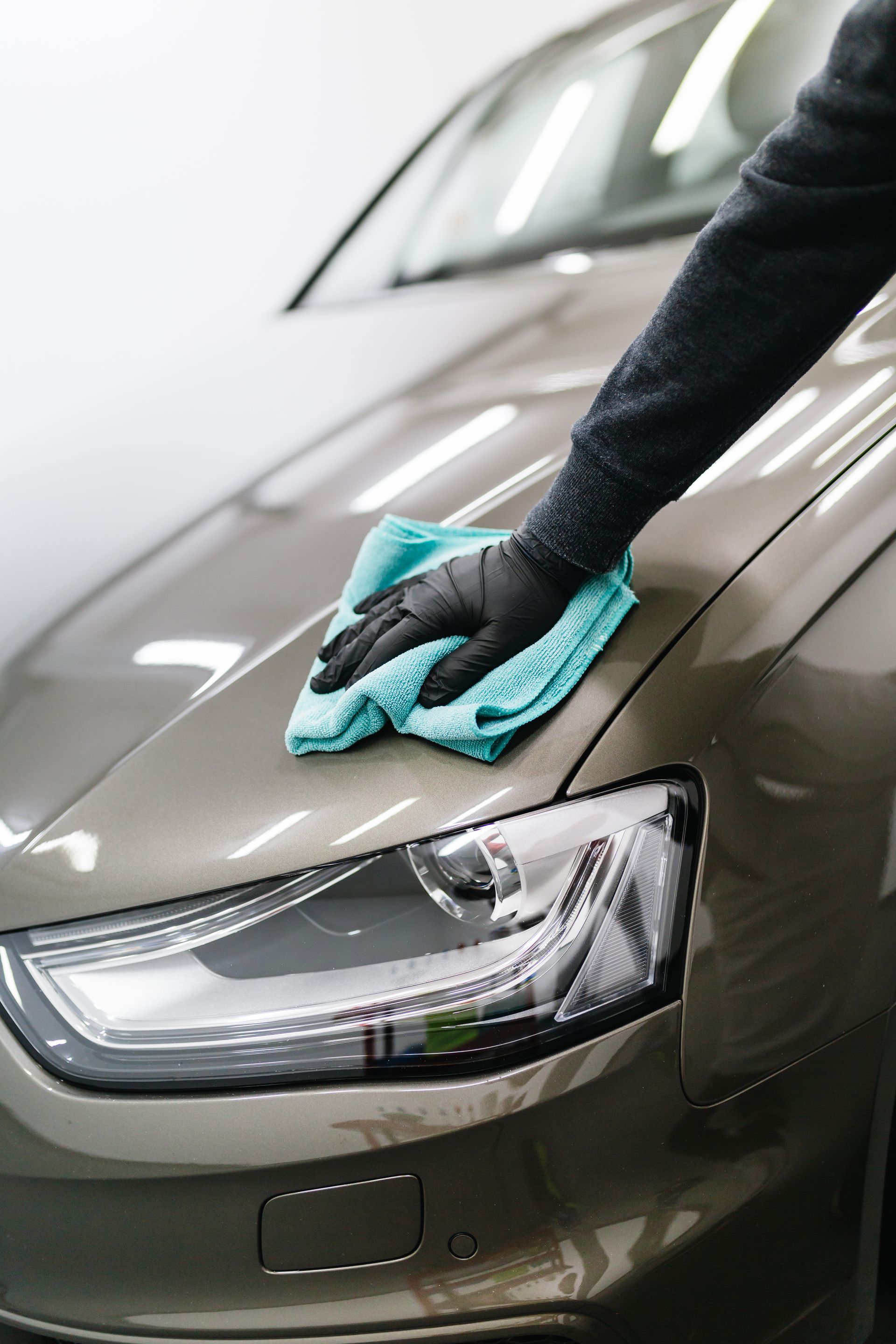 specialist cleaning and wiping car for detailing