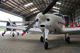 small private aircraft in hanger