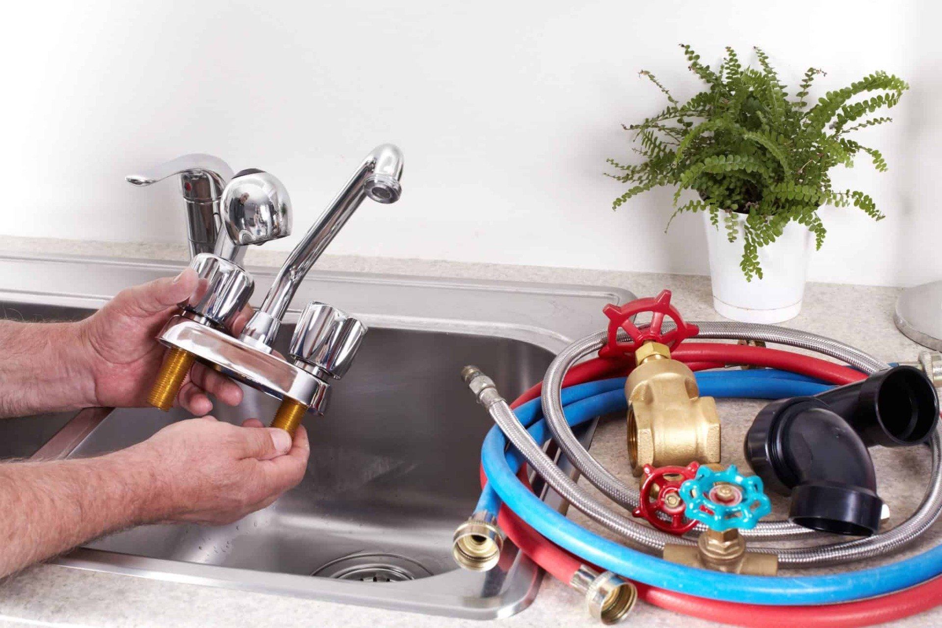Plumber with a water tap.