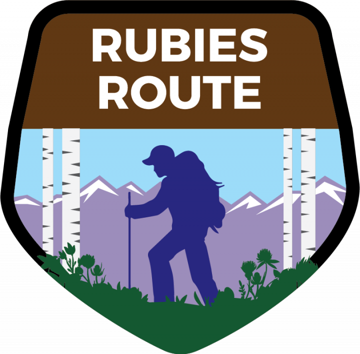 A logo for the rubies route with a silhouette of a person hiking