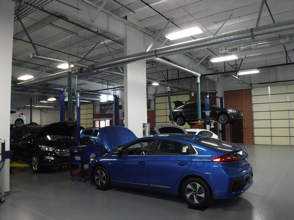 Hyundai Dealer — Blue Car in Car Workshop in Fredericksburg, VA