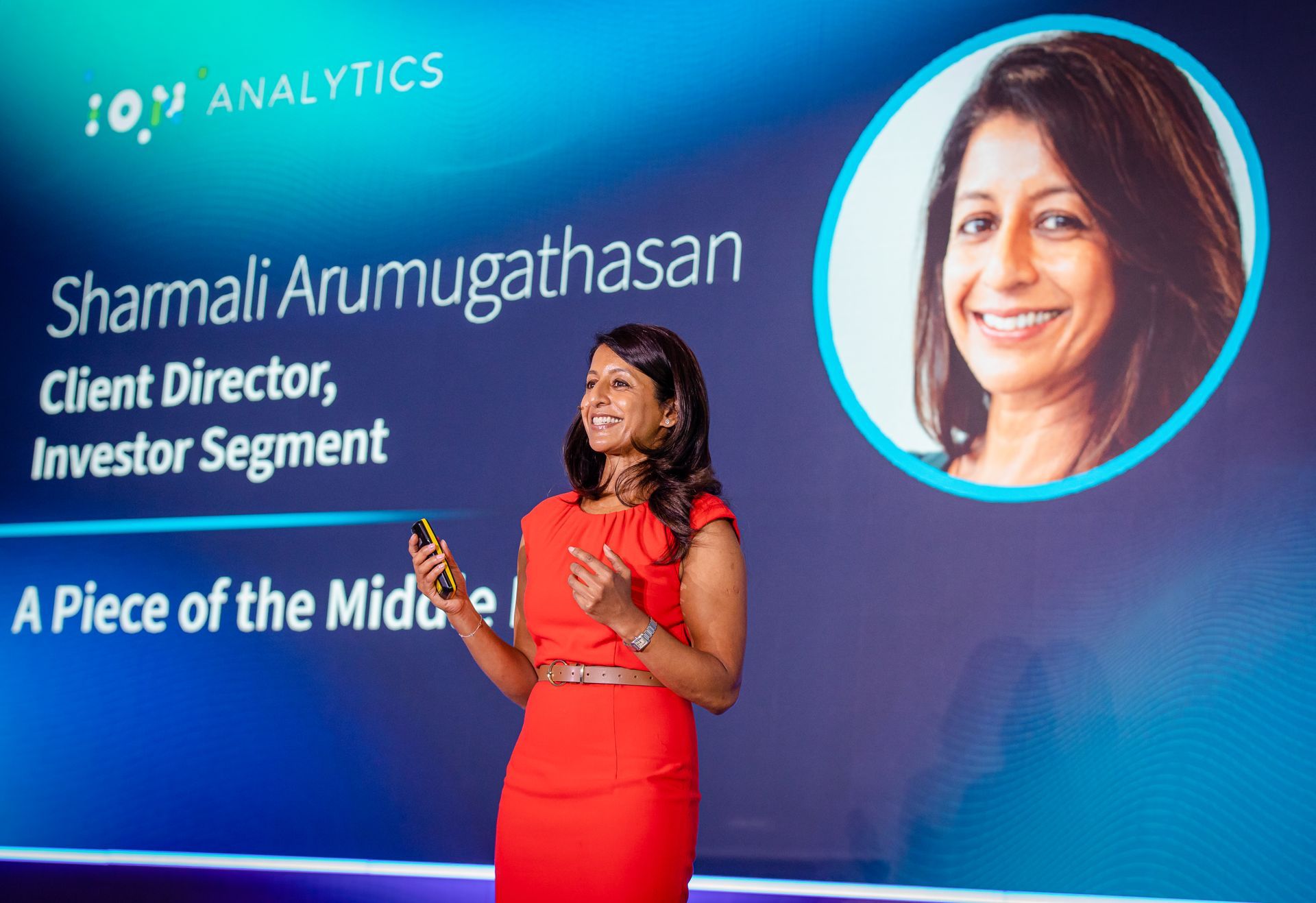 A photo taken by Ash Garwood of a woman presenting at a town-hall style corporate event.