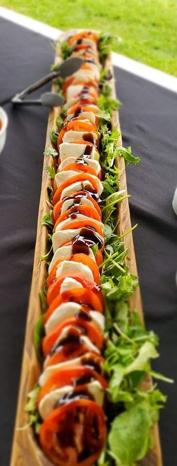 Grilled cheese sandwiches with fries in a paper container on a wooden surface.
