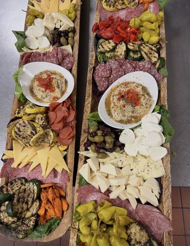 Fruit salad with berries, and fried bread on a table.