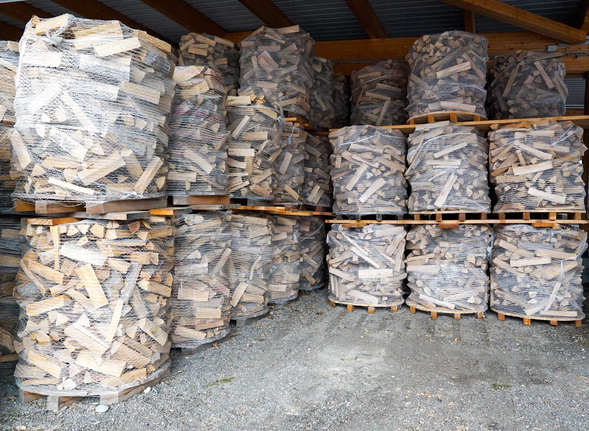 A bunch of bags of wood are stacked on top of each other