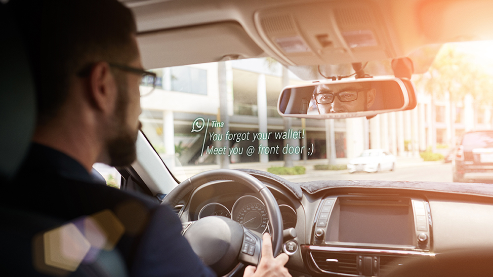 Man in car wearing Smart Sunglasses which debuted at the Consumer Electronics Show 2020