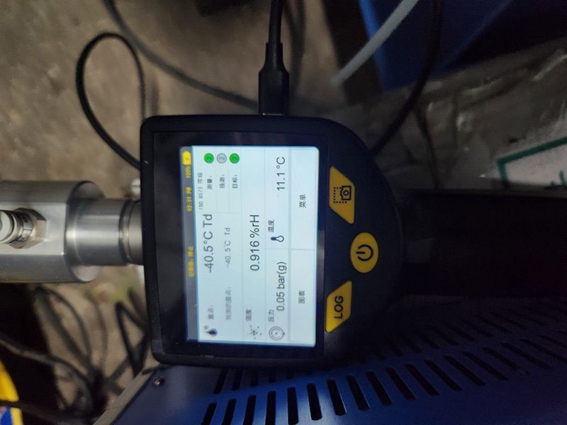A mobile dew point meter with a screen that says 45 degrees celsius.