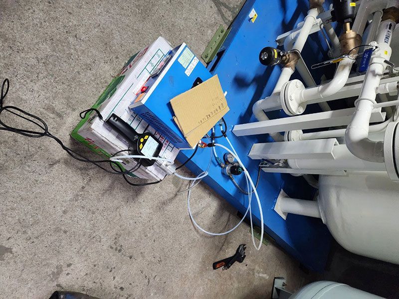A bunch of wires are connected to a mobile dew point meter.