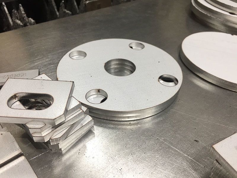 A bunch of metal pieces are sitting on a table