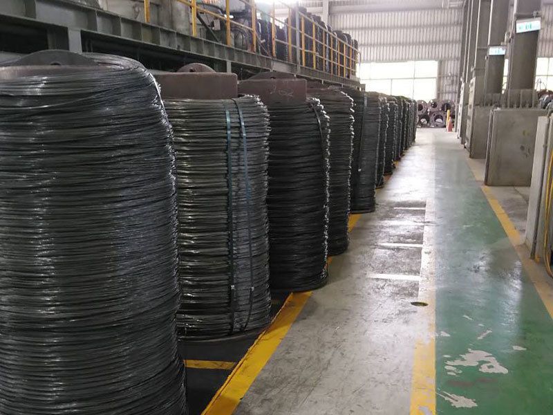 A warehouse filled with lots of rolls of wire.