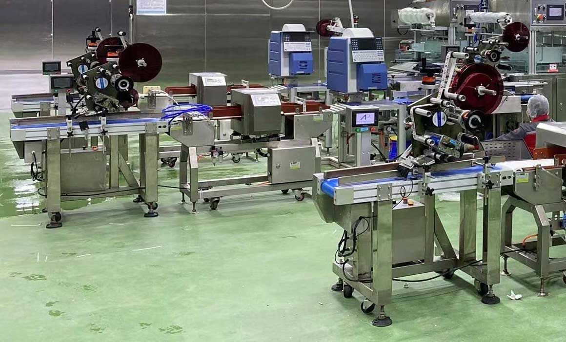 A photo of food packaging process in a factory.