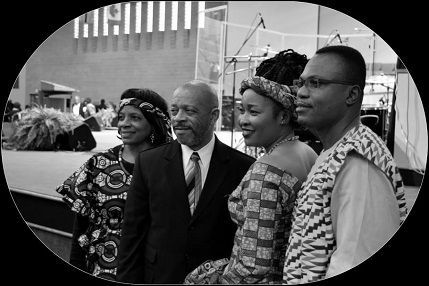 A black and white photo of a group of people posing for a picture