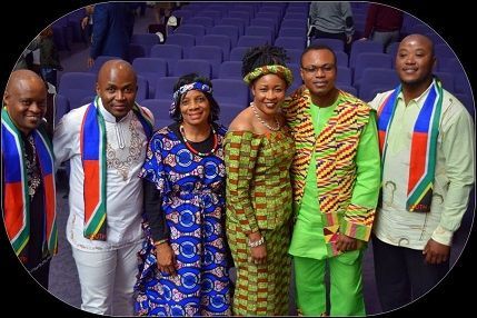 A group of people are posing for a picture together