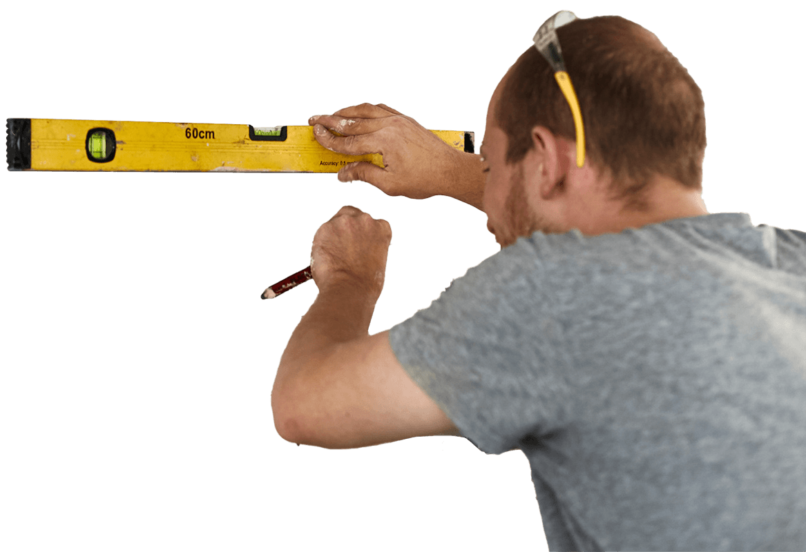 Workman checking alignment with spirit level