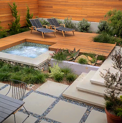 Patio with small swimming pool and steps decorated with plants