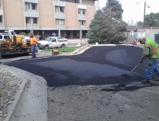 A group of men are working on a road