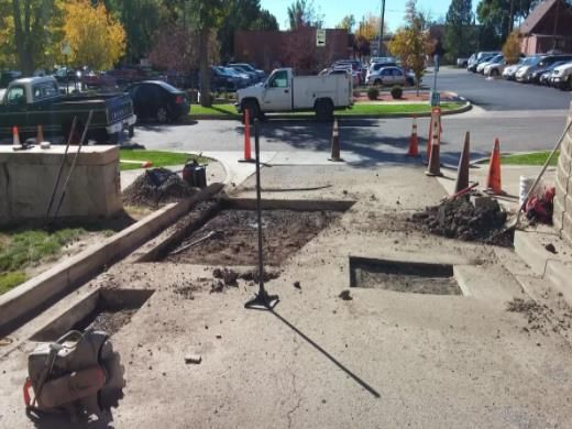 A white truck is parked on the side of the road