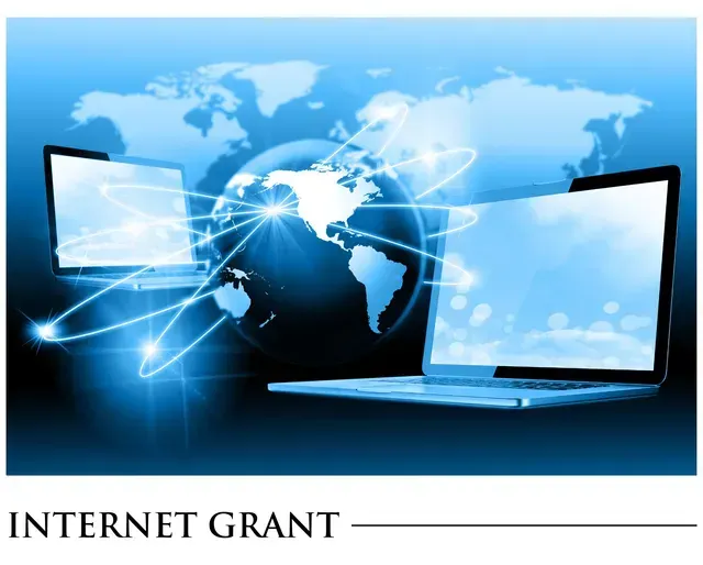 A blue background with two laptops and the words internet grant
