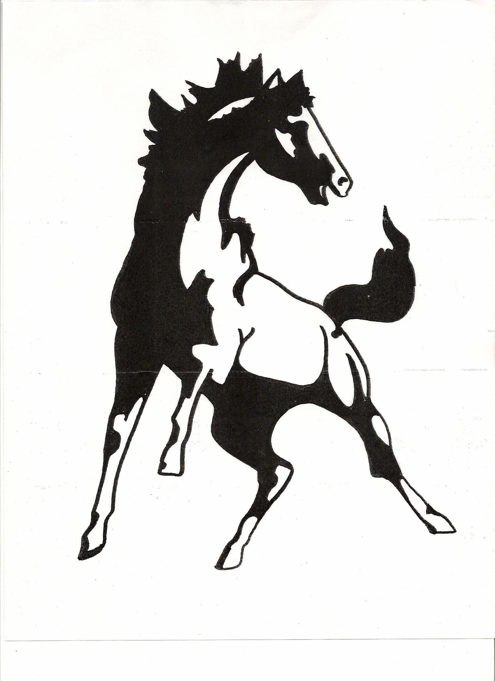 A woman with long brown hair is smiling for the camera.