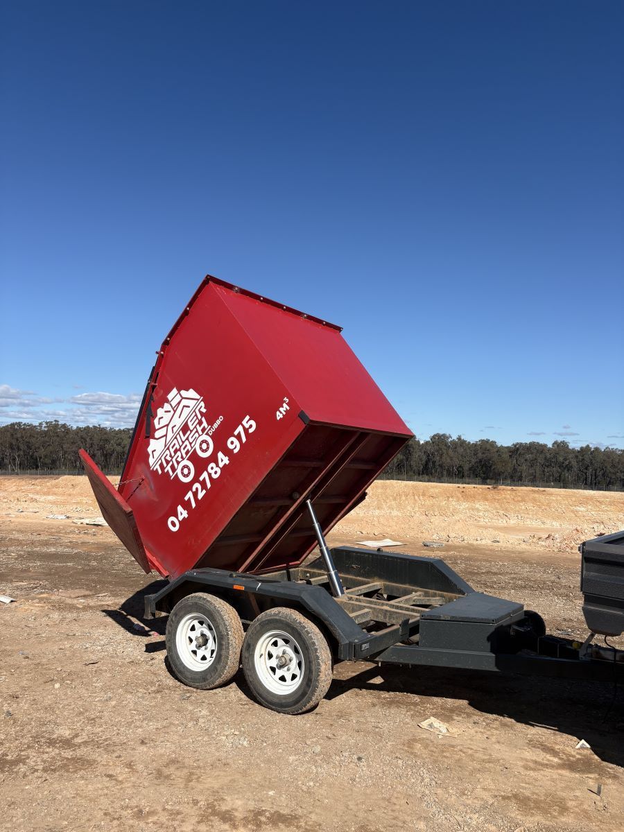 Blue Dumpster on A Sidewalk Near a Construction Site — Trailer Trash Dubbo in Narromine, NSW