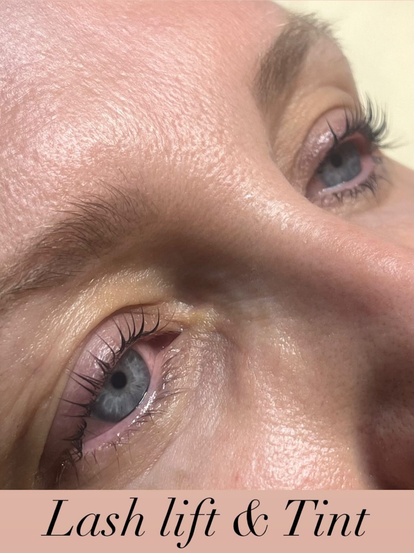 Close-up of eyes with lash lift and tint; light-colored lashes and skin.