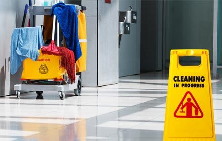 Janitorial and mop bucket on cleaning in process