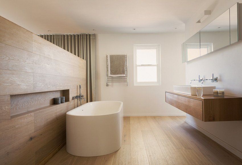 interior bathroom design with wooden partition and bath tub