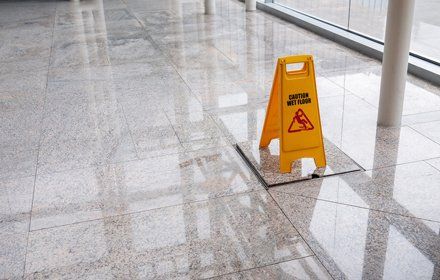 wet floor sign on lobby floor