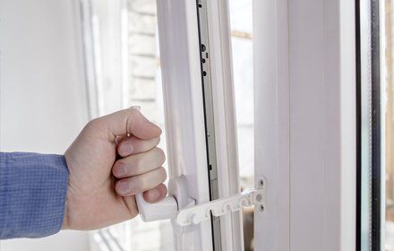 man holding glass door handle