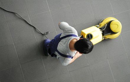 Man vacumming the floor