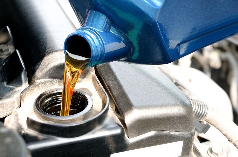 Refueling And Pouring Oil Quality Into The Engine Motor Car Transmission — Tamworth Manual Transmission Factory In Narrabri, NSW