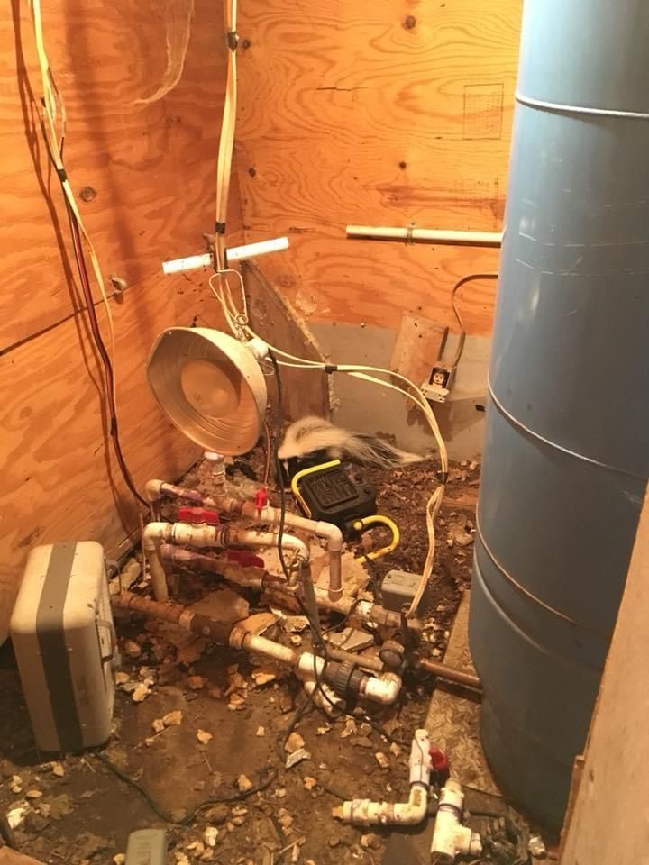 A room with a lot of pipes and wires on the floor | Eldon, MO | Beanland Well Drilling & Pump