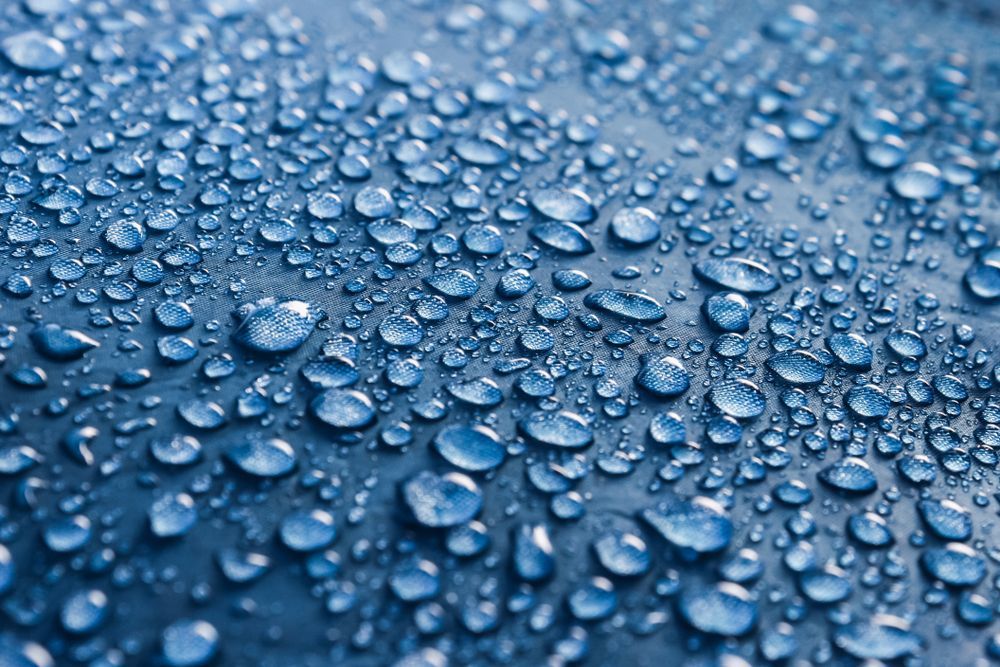 A Close Up Of Water Drops On A Blue Surface — Citrus Clean Central Coast In Lake Haven, NSW