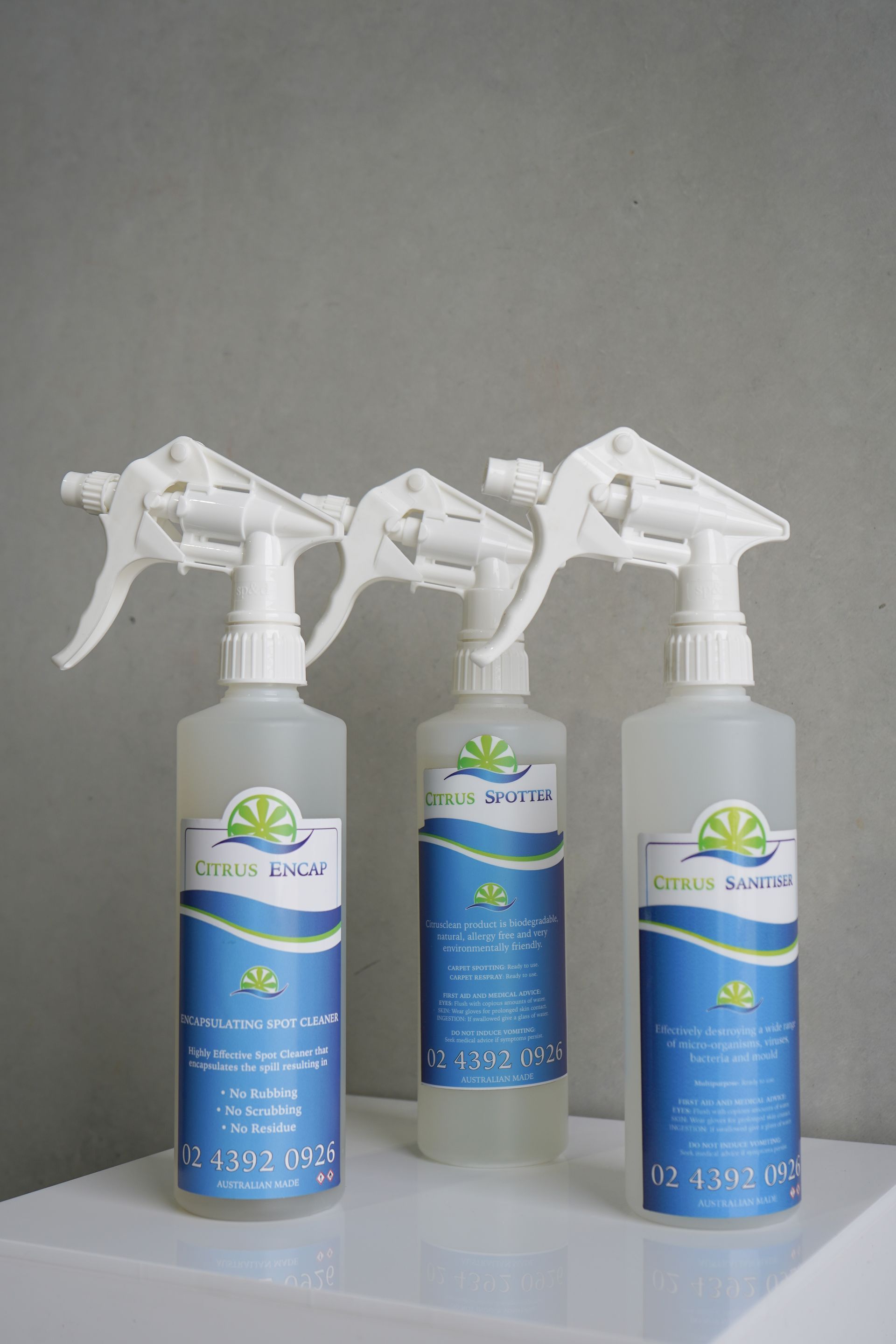 Three Spray Bottles and a Box of Wipes Labeled Citrus Clean Against a Gray Background — Citrus Clean Central Coast In Lake Haven, NSW