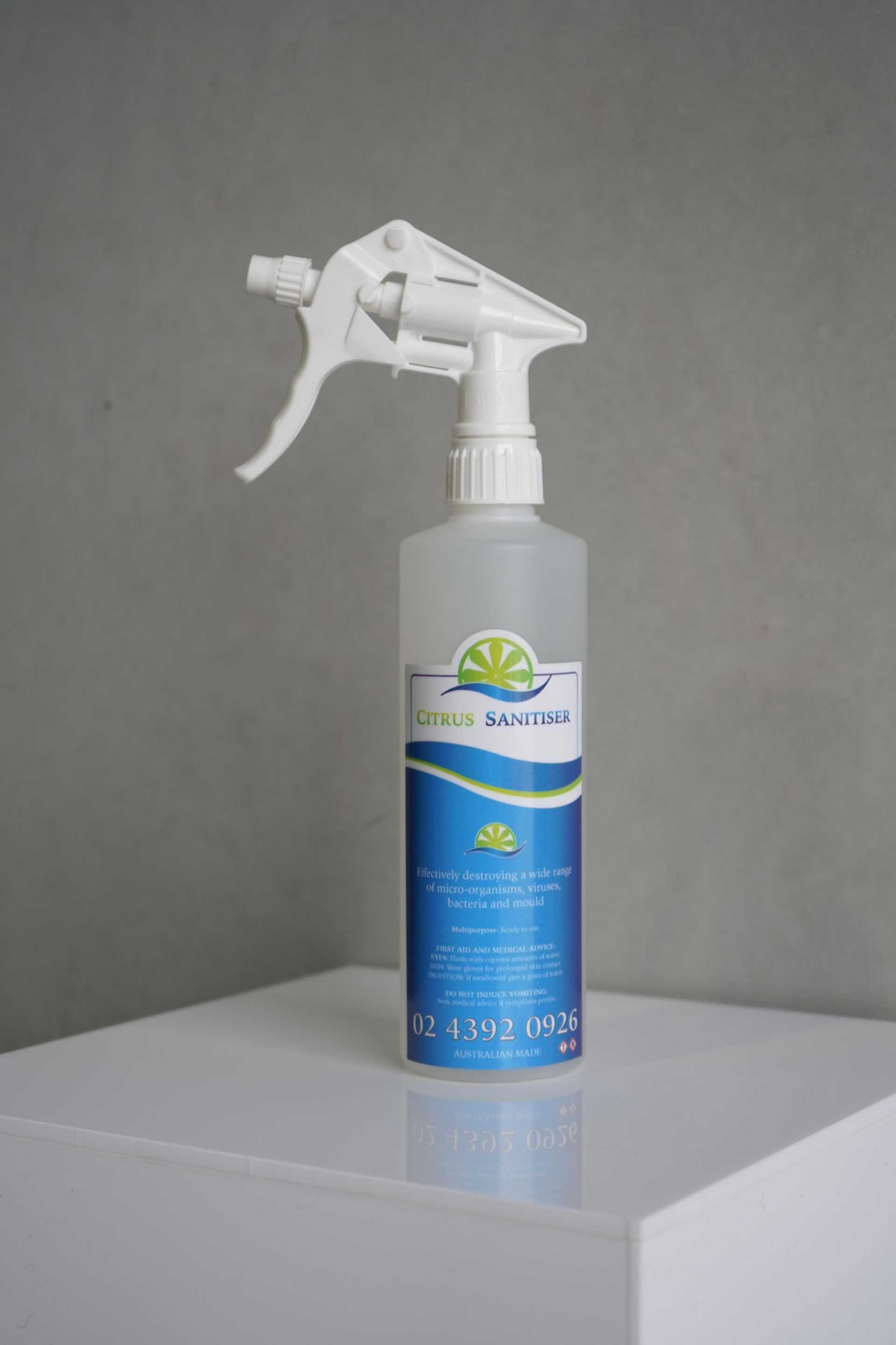 Spray Bottle of Clean Balance Cleaner on a White Surface Against a Gray Backdrop — Citrus Clean Central Coast In Lake Haven, NSW