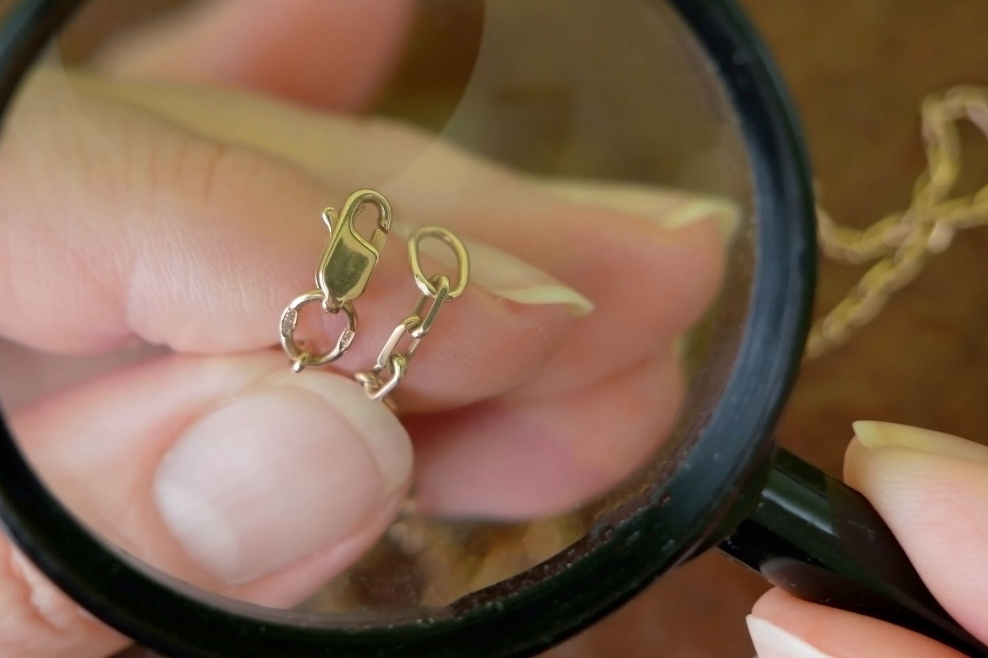 jeweler looking at golden chain through magnifying glass, jewerly inspect and verify, pawnshop jeweler looking at golden chain through magnifying glass, jewerly inspect and verify, pawnshop